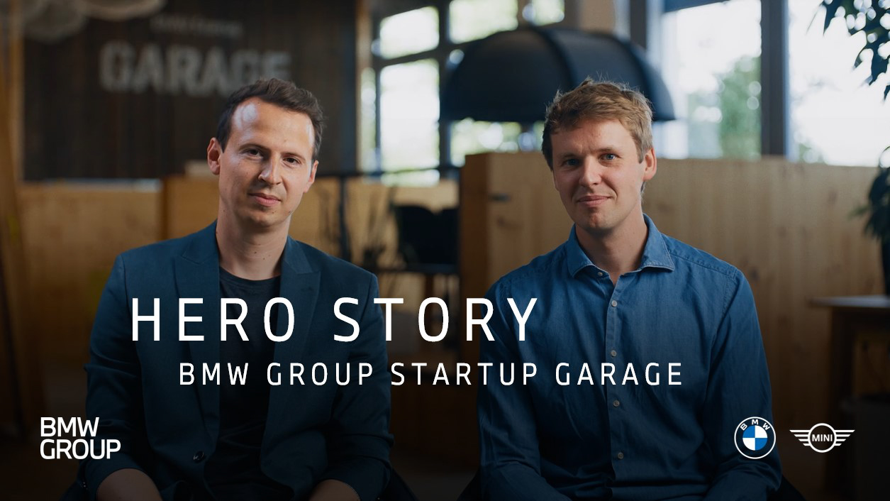 Thiemo and Lukas, BMW Group employees sitting in an innovative office environment at the BMW Group Startup Garage