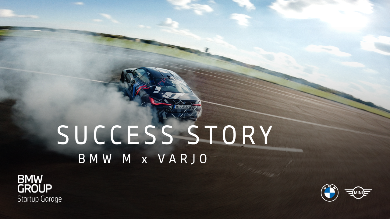 A BMW vehicle is drifting dynamically on a track.